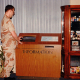 Explore the history of kiosks: A DoD servicemember uses one of DynaTouch's earliest information kiosks, featuring a classic wood panel exterior.